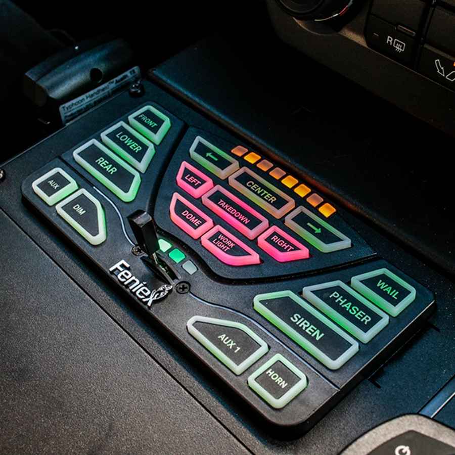 Feniex 4200 Data-Link Controller panel with colorful buttons and labels on a vehicle dashboard