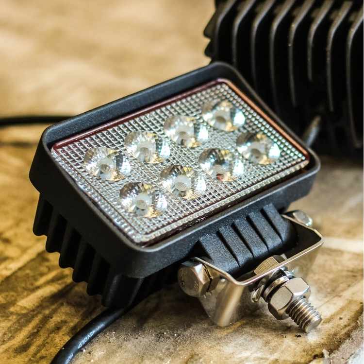 Feniex AM900 Work Light on a textured surface