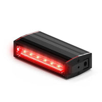 Black and red rectangular Feniex Q-100 Stick LED light on a white background