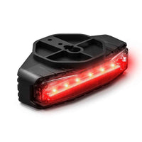 Black Feniex Q Serial Under Mirror with red LED lights on a white background