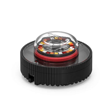 A Feniex Quad Cannon emergency warning light with a black housing and a clear dome displaying the multicolor settings.