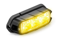 Yellow Feniex Quad Q3 light on a white background
