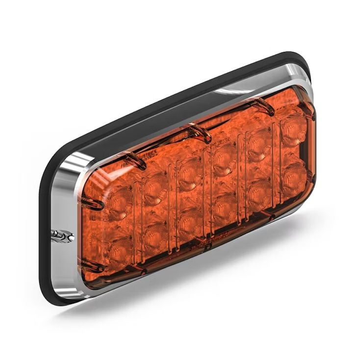 Rectangular amber Feniex Spot Lux 7x3 LED light with chrome frame on a white background