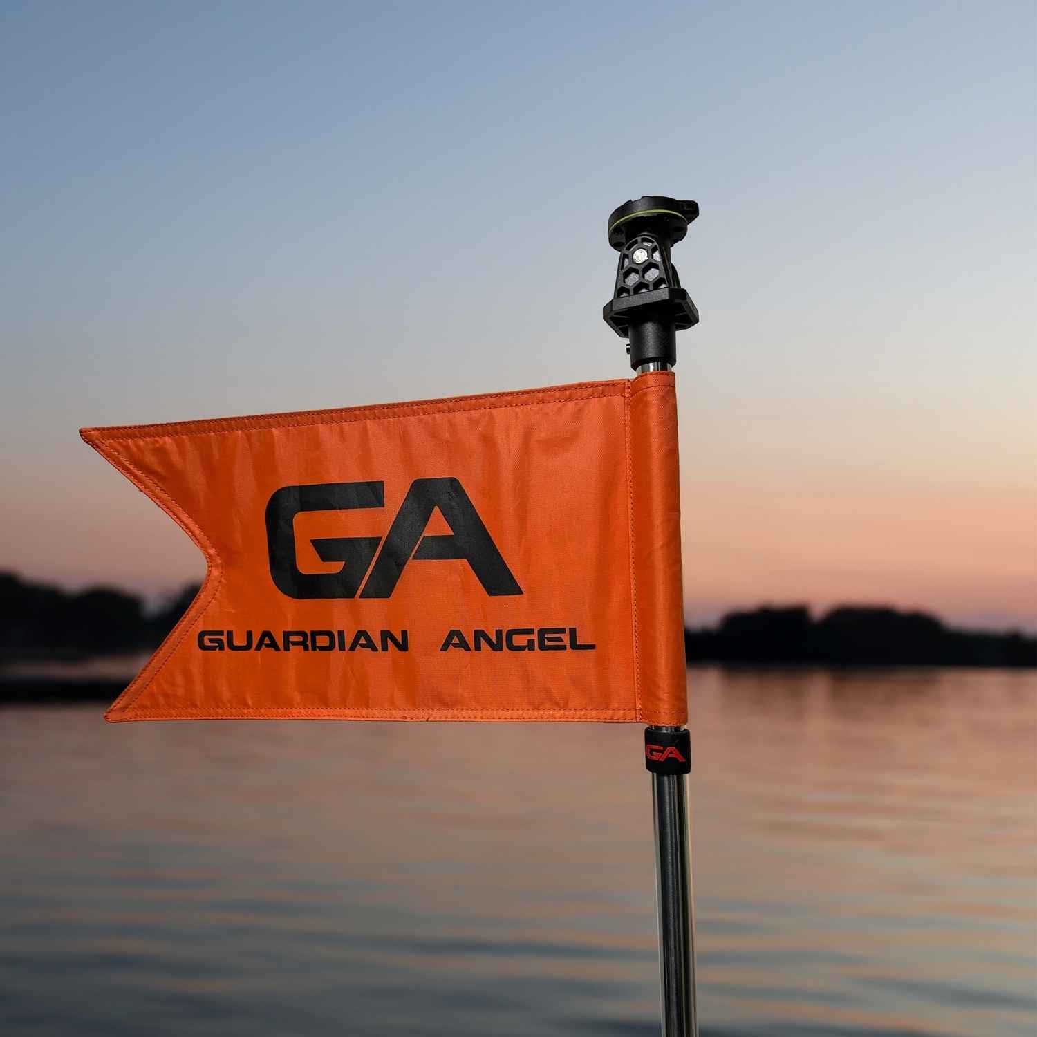 Guardian Angel - 12″ Tube and Orange flag with 'GA Guardian Angel' branding on a pole against a sunset sky.