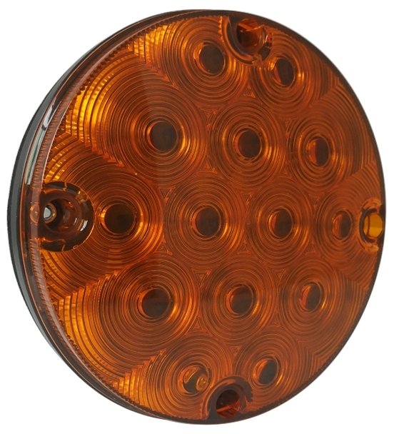 Round amber LED light on a white background