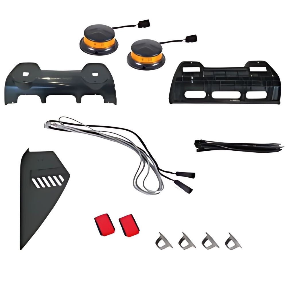 Collection of automotive parts including a bumper, wiring harness, and brackets on a white background