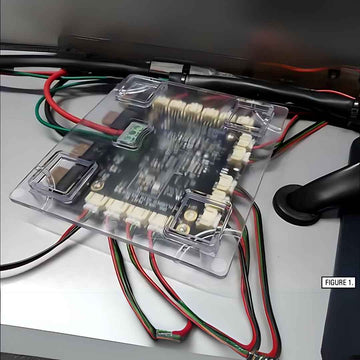 SoundOff Distribution Board with wires on a white surface