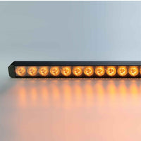 Row of amber LED lights on a reflective surface with a light gray background
