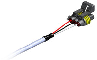 Close-up of a mechanical component with red and white wires on a white background