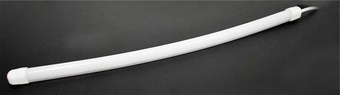 A white, flexible LED strip light with a diffused glow, designed for customizable RGB lighting.