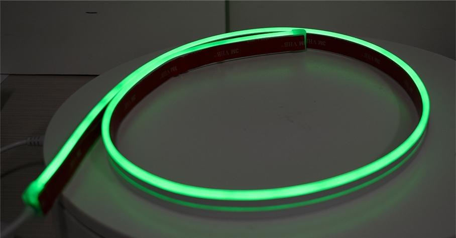Green LED strip light on a dark background