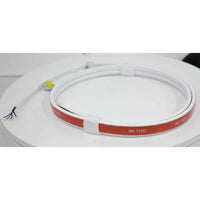 A coiled red and white TecNiq E48 ultra thin diffuse strip RGB light with visible LED components on one end.