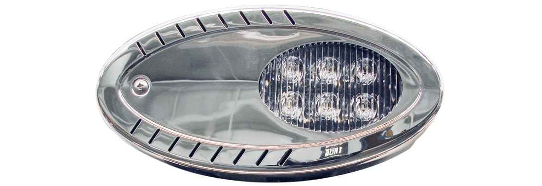 Oval-shaped vehicle light with metallic finish on a white background