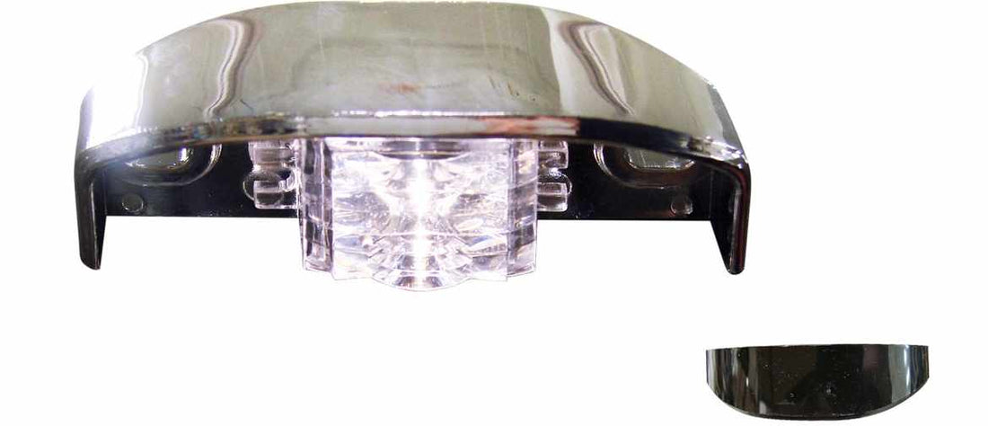 TecNiq L12 LED license lamp for vehicles, showing the lamp with a clear lens and silver housing, mounted on a surface.