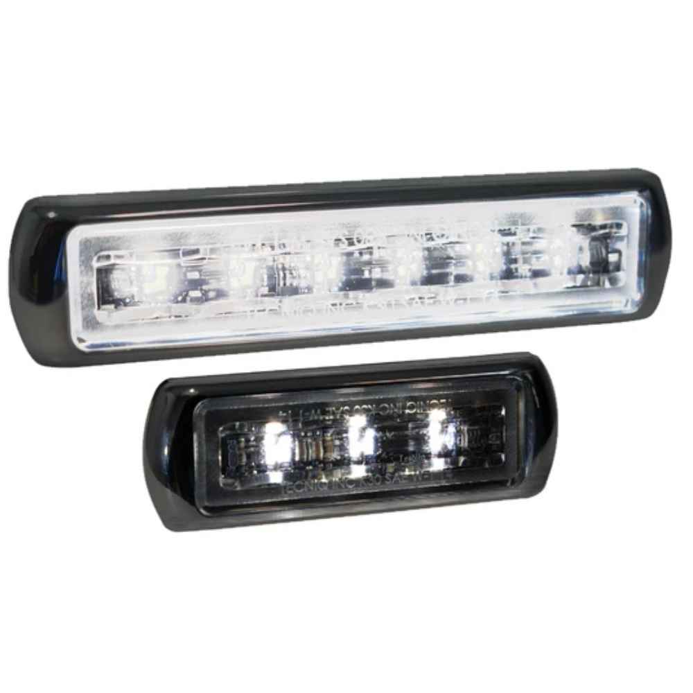 Two TecNiq M30 ancillary white lights, with a black casing and bright LED lights visible through a clear lens.