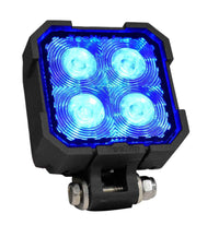 A black, compact LED accent light with four blue illuminated lenses, designed for mounting on vehicles or equipment.