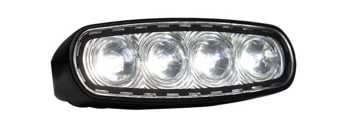 Car fog light with four clear lenses on a white background
