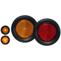 Set of round reflective markers in orange and red on a white background