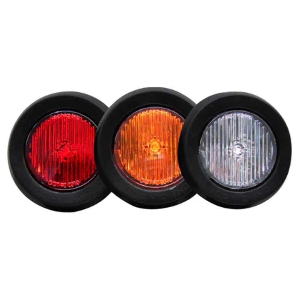 Three round  TecNiq S30 lights in red, orange, and clear on a white background