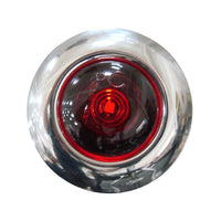 Red tail light with chrome casing on a white background