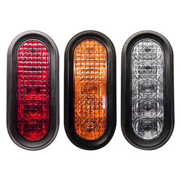 Three TecNiq T60 : 6" Oval Stop/Tail/Turn Grommet Mount in red, orange, and clear on a white background